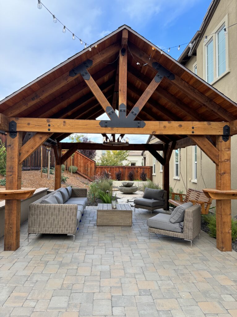 Enhance your outdoor oasis with our exquisite redwood gazebo and pergola offerings, complete with electrical features.